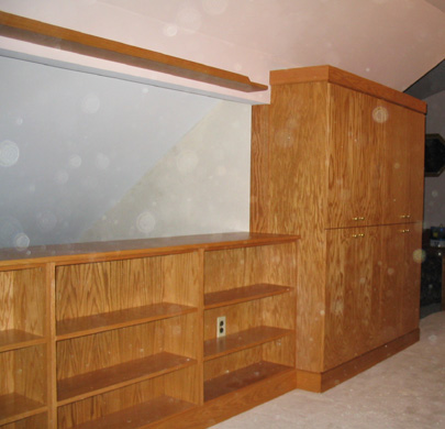 Built-in golden oak bookcase and cabinets